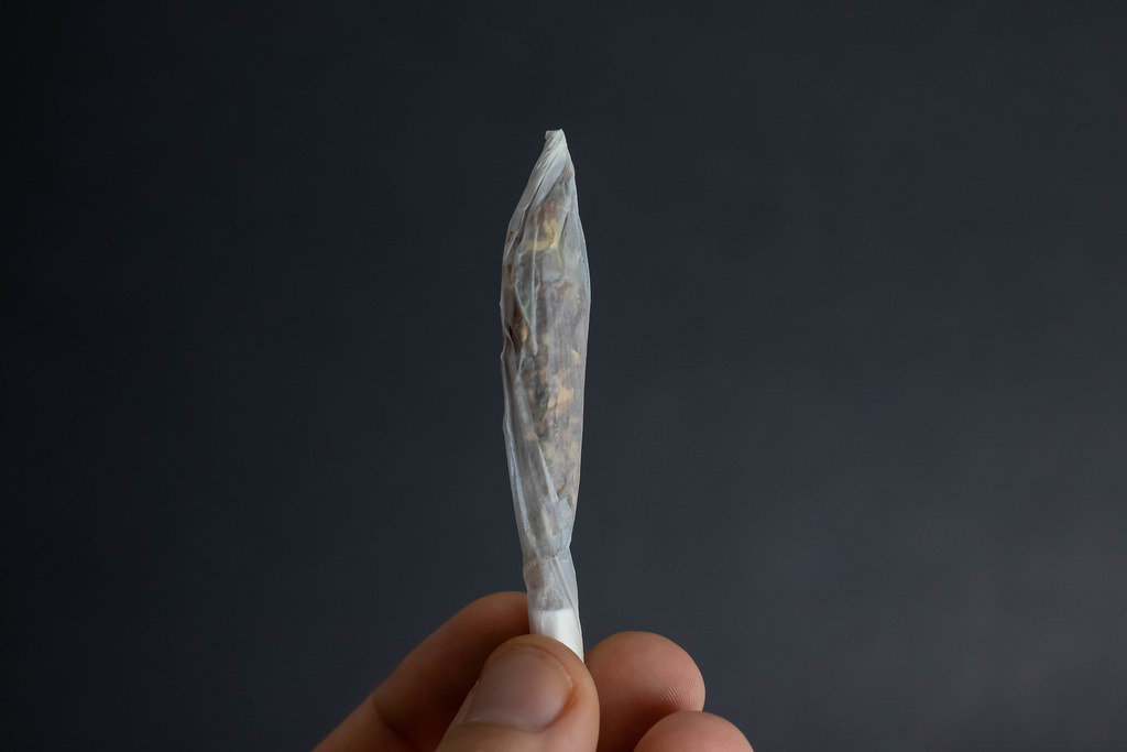 Man holding joint in his hand