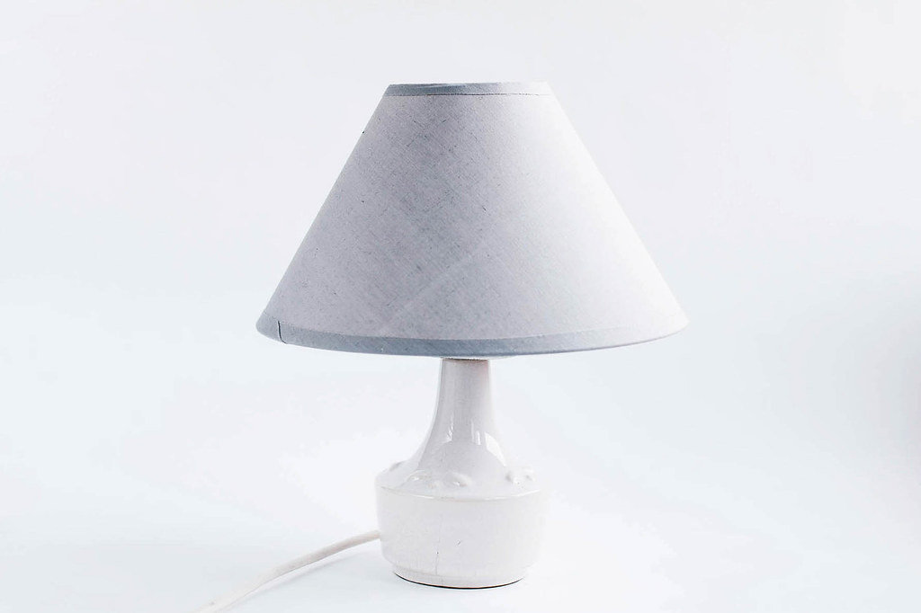 Grey home lamp on white background .