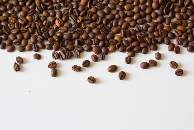 Coffee beans on white table
