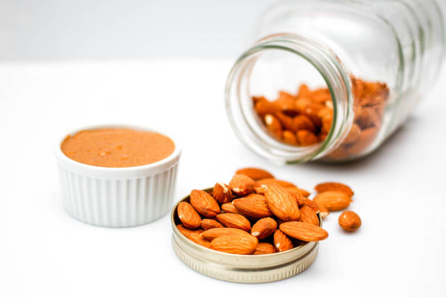 Almond with Almond Butter on a White Background