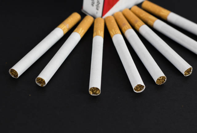 Pack of cigarettes on black background