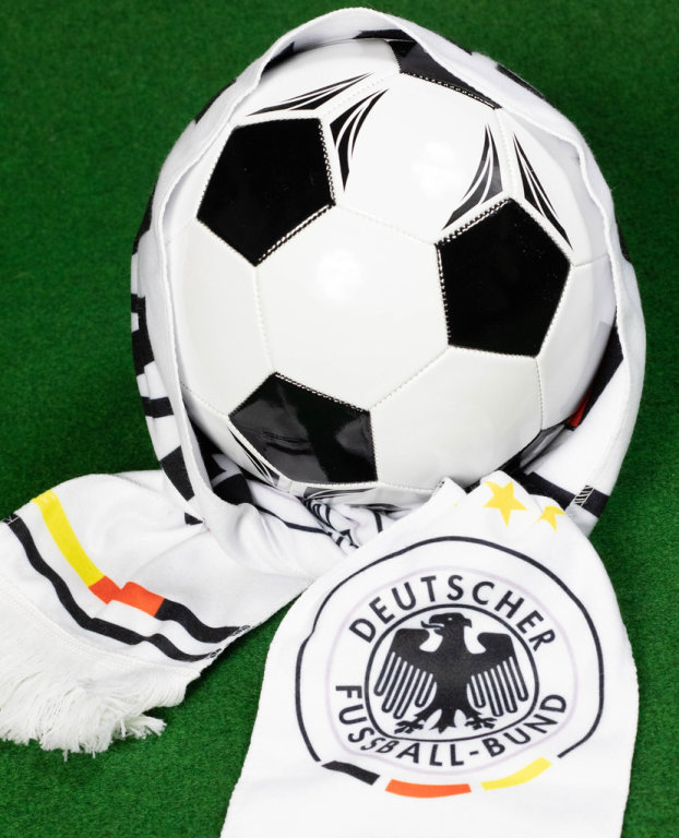 Soccer ball covered with German fan scarf