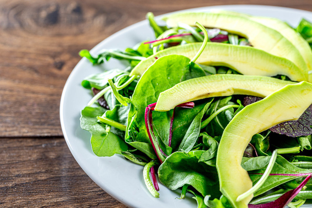 Green salad with salad mix and avocado slices