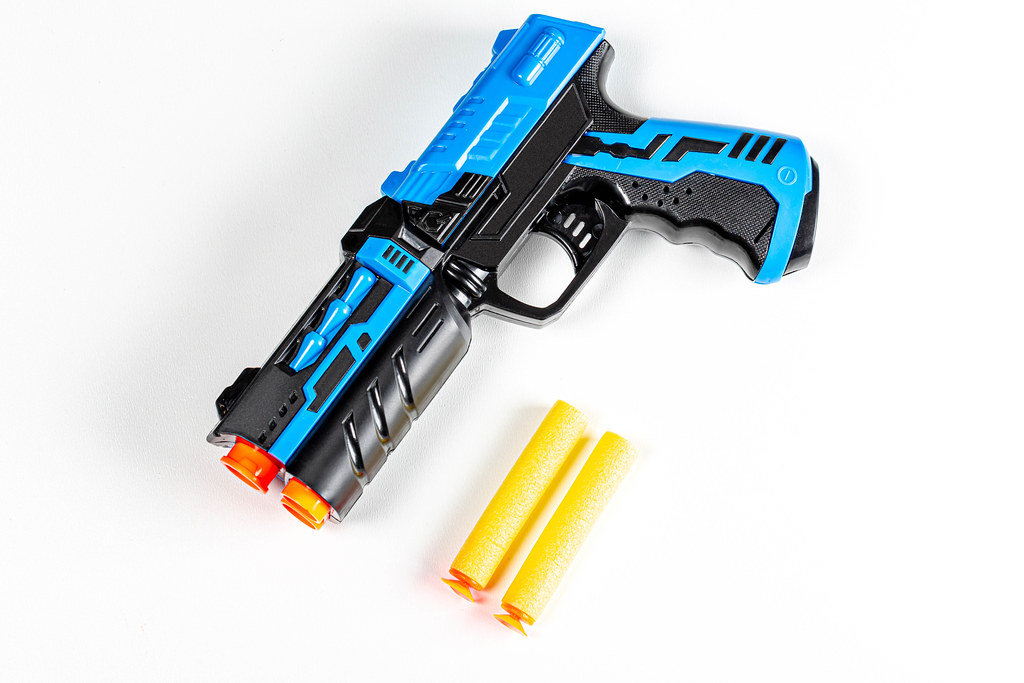 Childrens plastic pistol with cartridges