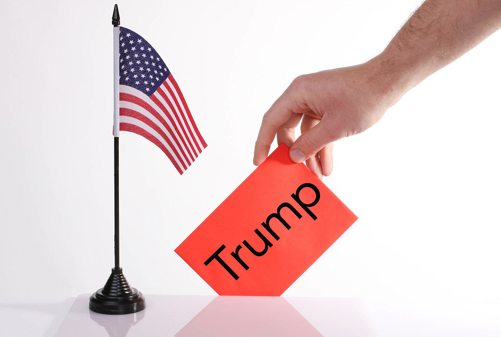 American flag and envelope with Trump text