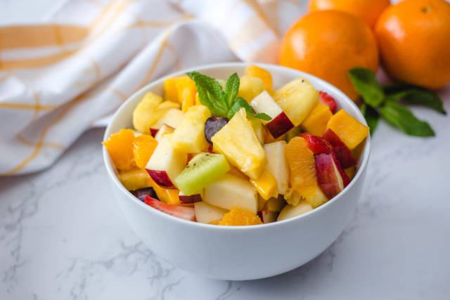 Fruit Salad With Ananas, kiwi, Apples, Strawberries, Orange and Mango