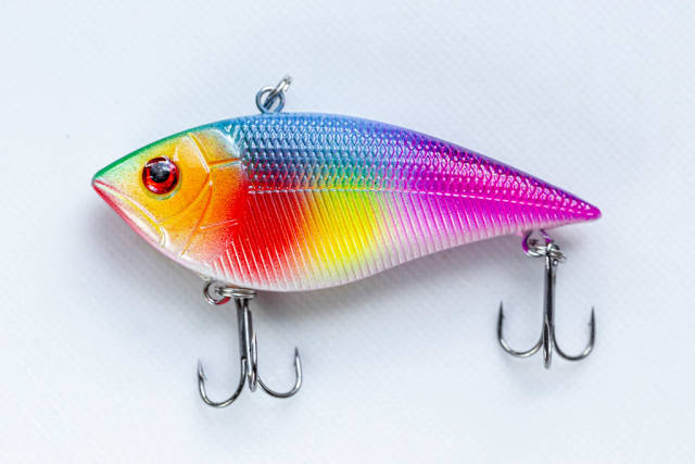 Colorful fish-lure for spinning on a white background