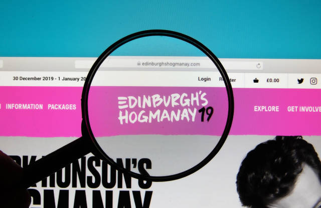 Edinburghs Hogmanay logo on a computer screen with a magnifying glass