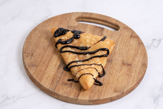 Pastry with Chocolate on the wooden board