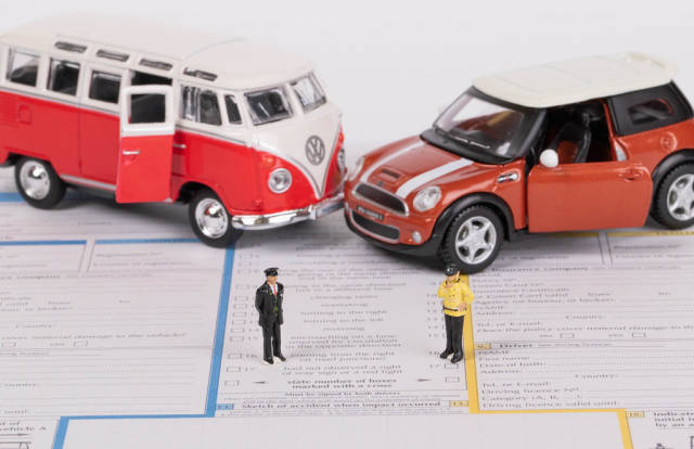 Two classic toy car on accident statement report