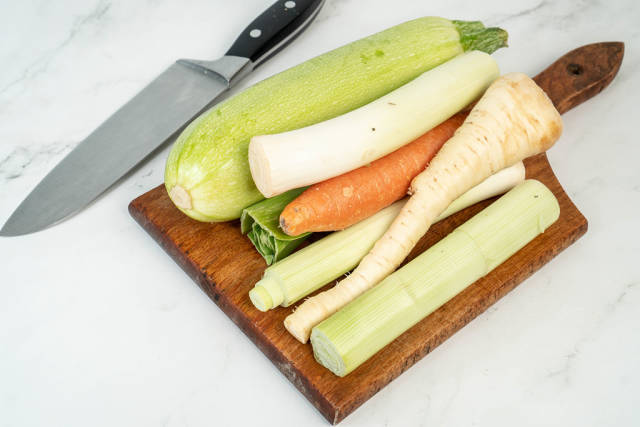 Zucchini Carrot and Parsnip on the wooden cutting board