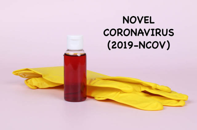 Protective gloves with blood sample and Novel Coronavirus text