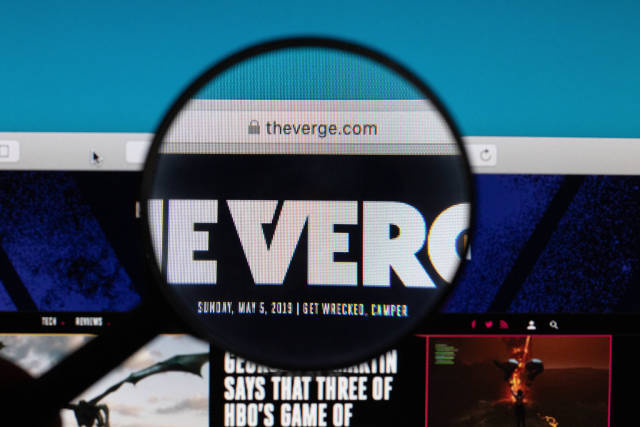 The Verge website under magnifying glass