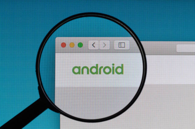 Android logo under magnifying glass