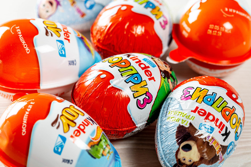 Kinder surprises background - chocolate eggs and kinder joy