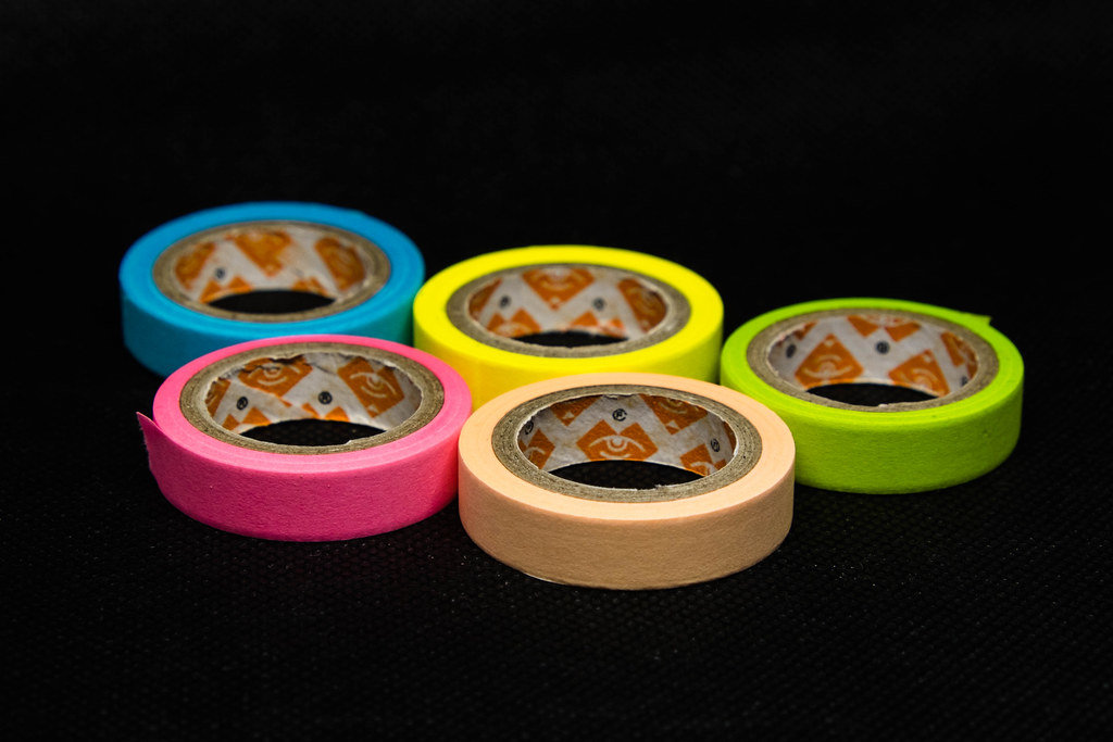 Colorful paper tapes on black background