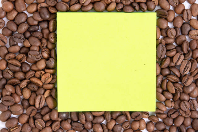 Raw Coffee arround empty copy space paper
