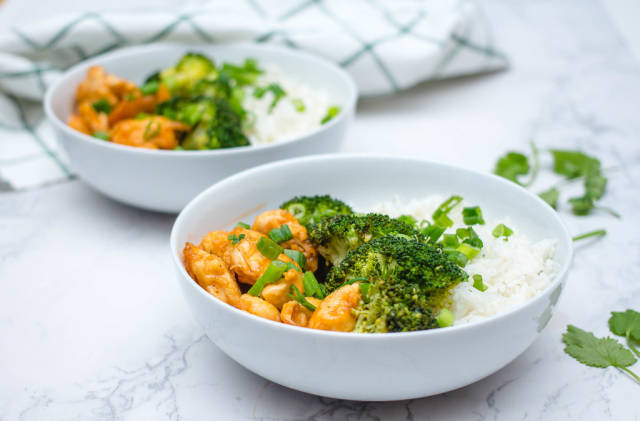 Sweet and Sour Chicken with Rice and Broccoli in a White Bowl