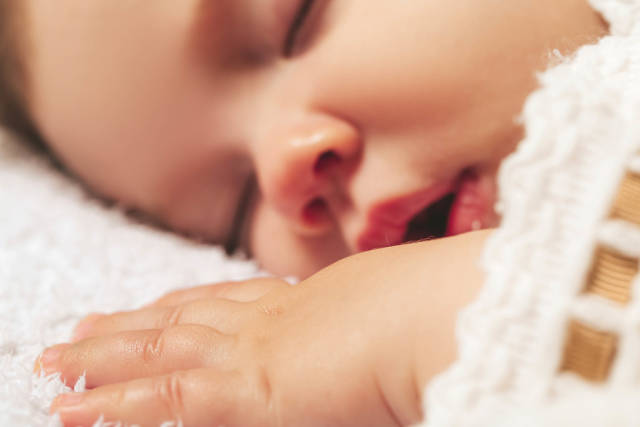 Close-up, portrait of a beautiful little boy while sleeping