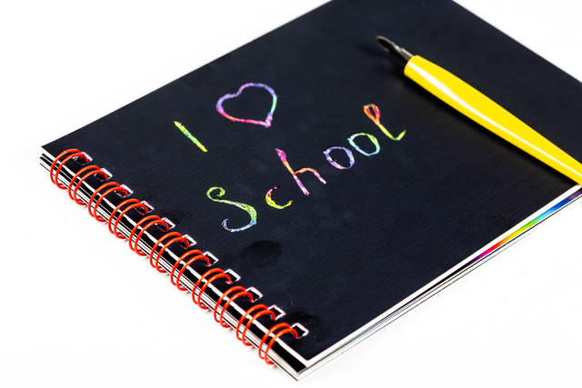Black notebook with multicolored lettering - I love school