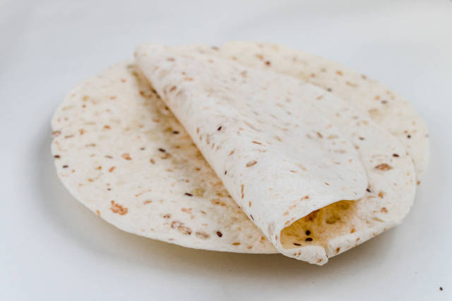 Stack of tortilla wraps and one folded wrap