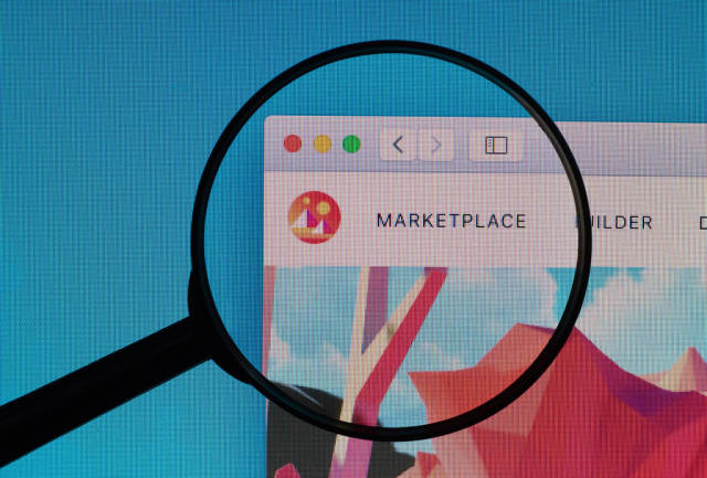 Decentraland Marketplace logo under magnifying glass
