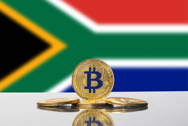 Golden Bitcoin and flag of South Africa