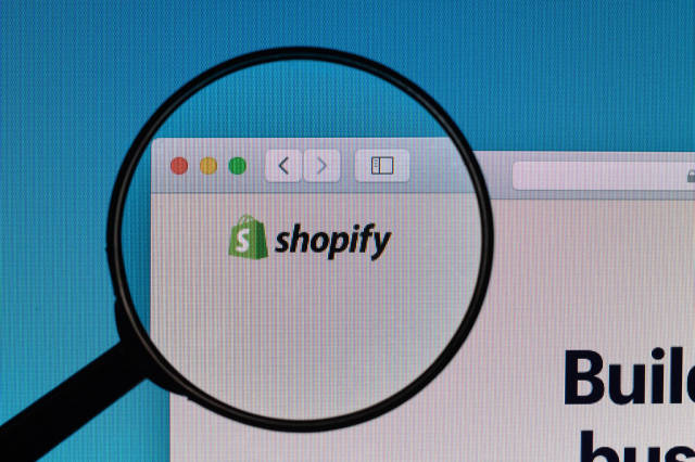 Shopify logo under magnifying glass