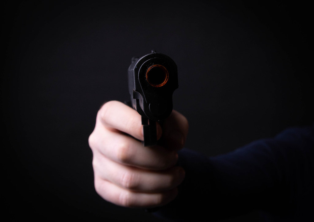 Hand holding a hand gun