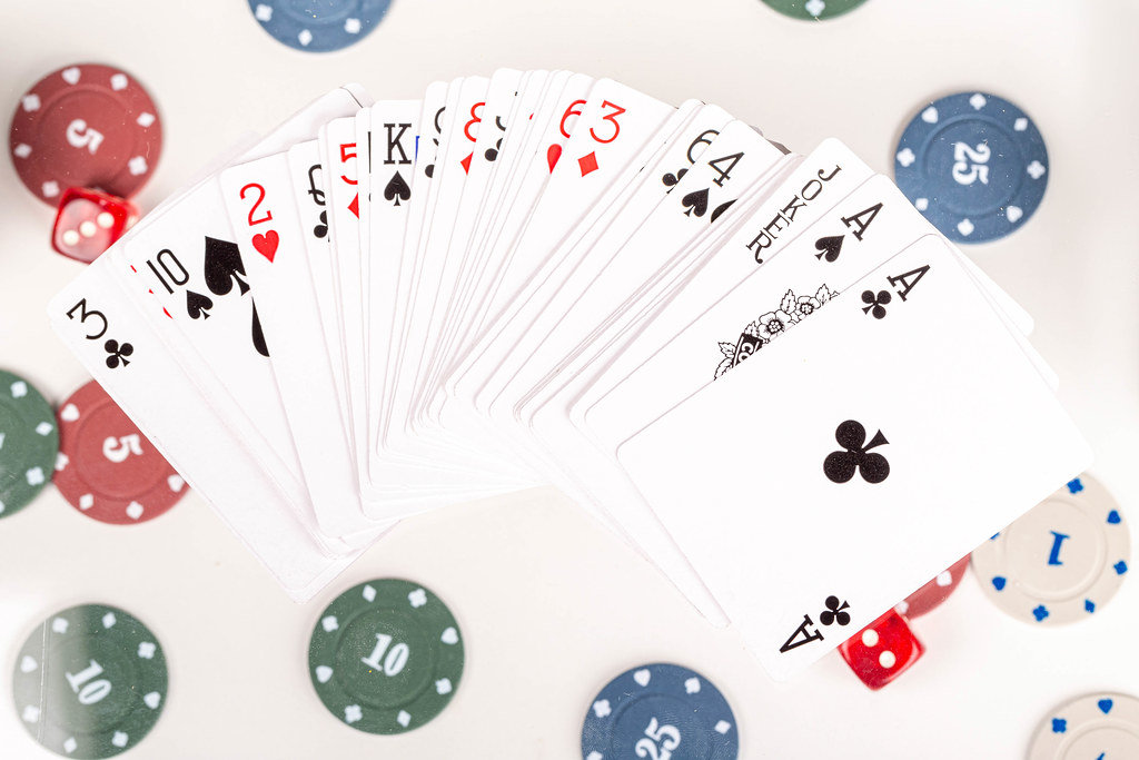 A deck of poker cards on the background of playing chips