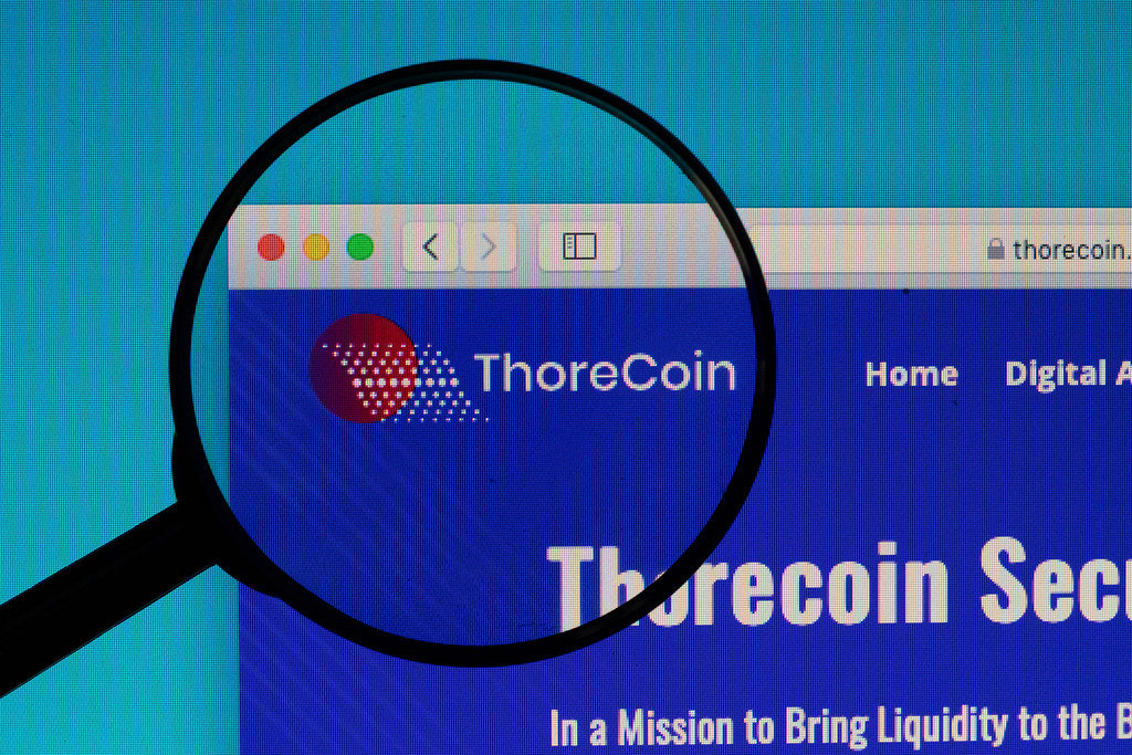 ThoreCoin logo under magnifying glass