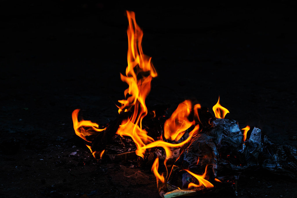Orange fire flames on dark background