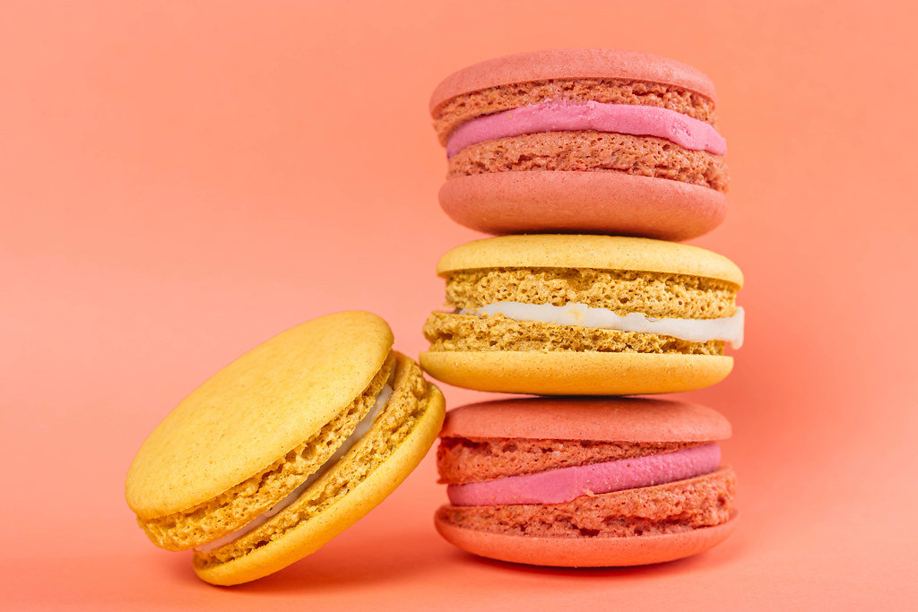 Sweet raspberry and lemon cookies on pink background