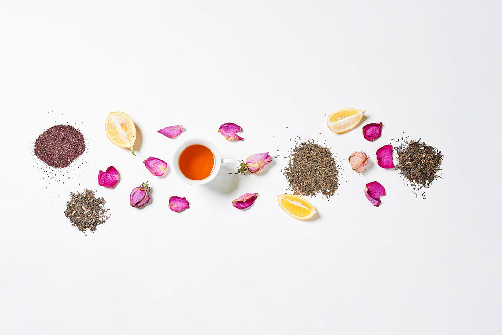 Exotic tea with flower petals and lemon slices