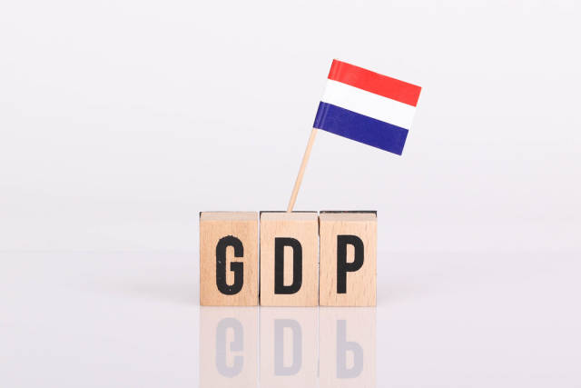 Wooden blocks with the word GDP and flag of Netherlands