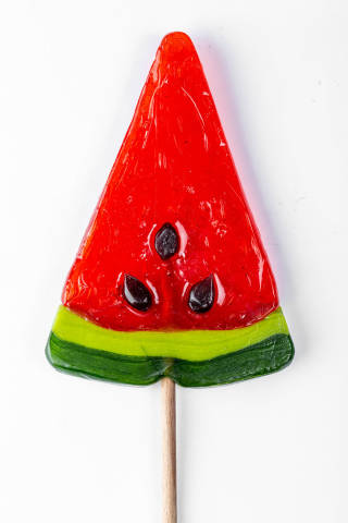 Candy lollipop watermelon on white background close-up