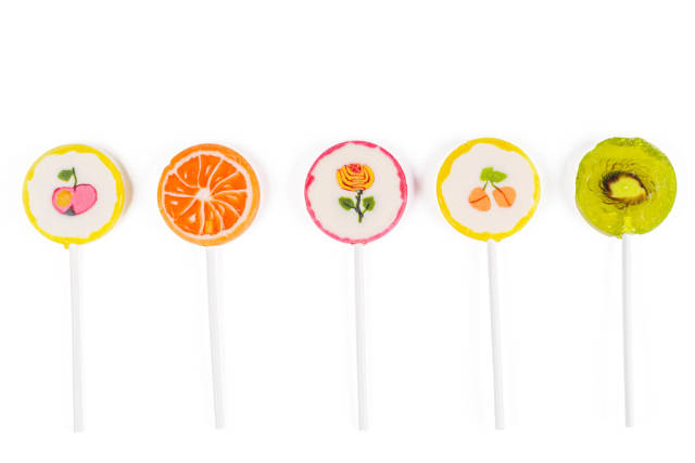 Multicolored lollipops on white background