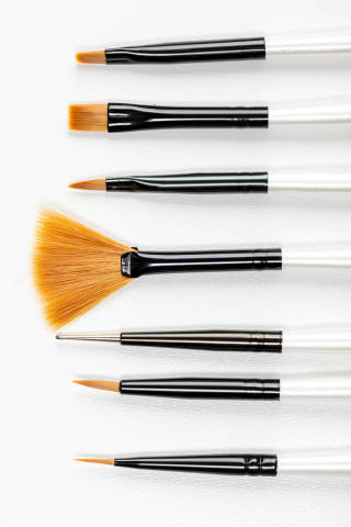 Various new makeup brushes on white
