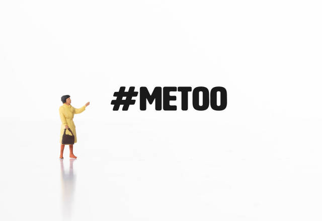 Woman pointing at #MeToo text