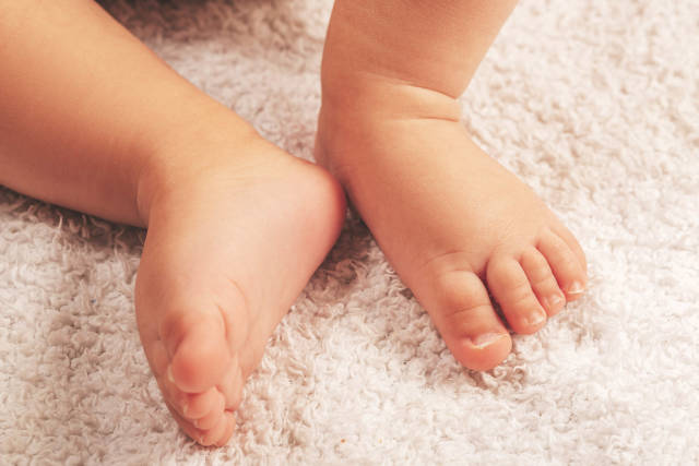 Little bare feet of a child, close-up