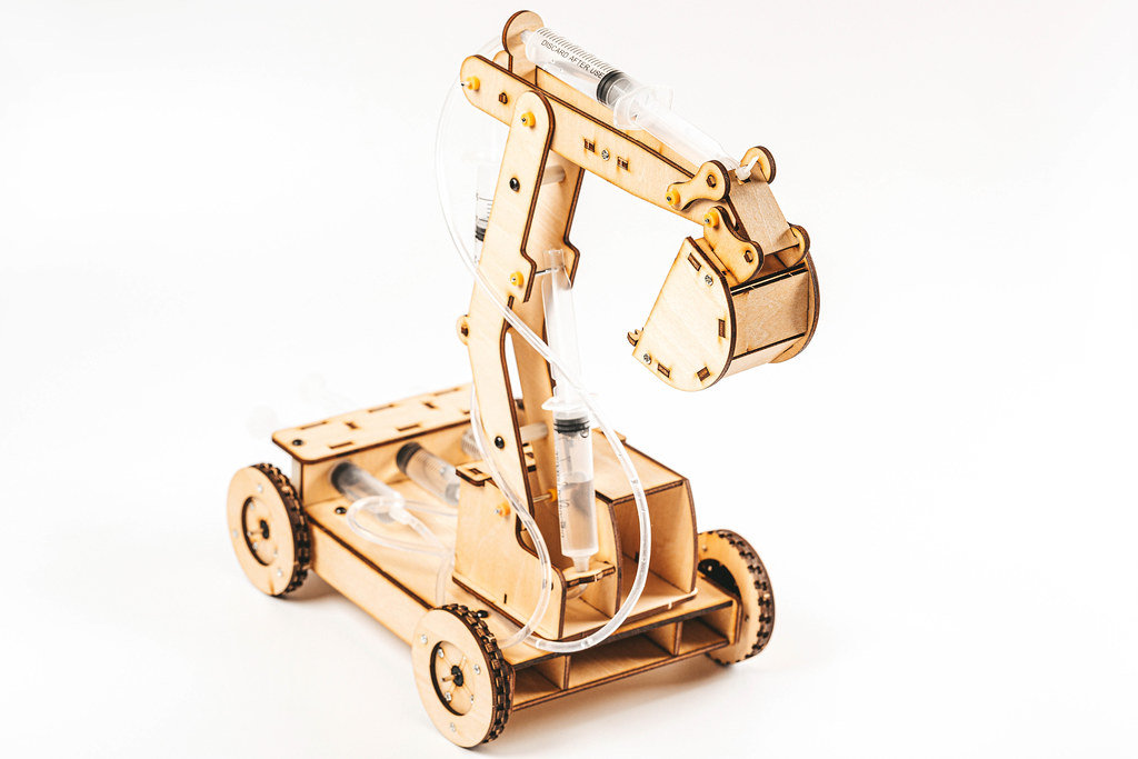 Toy constructor-excavator made of wooden parts