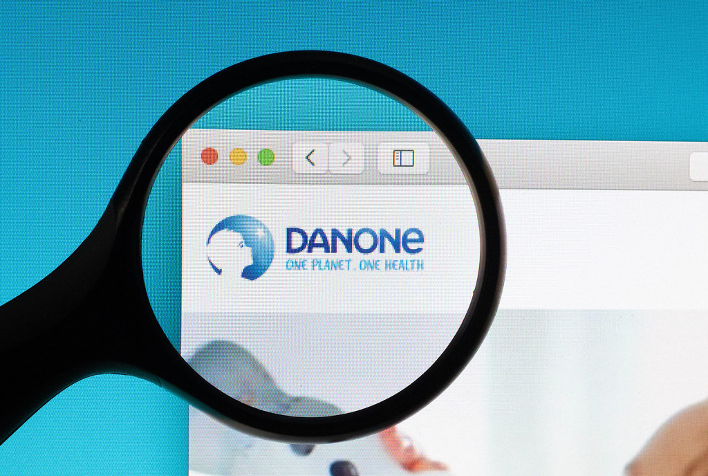 Danone logo under magnifying glass