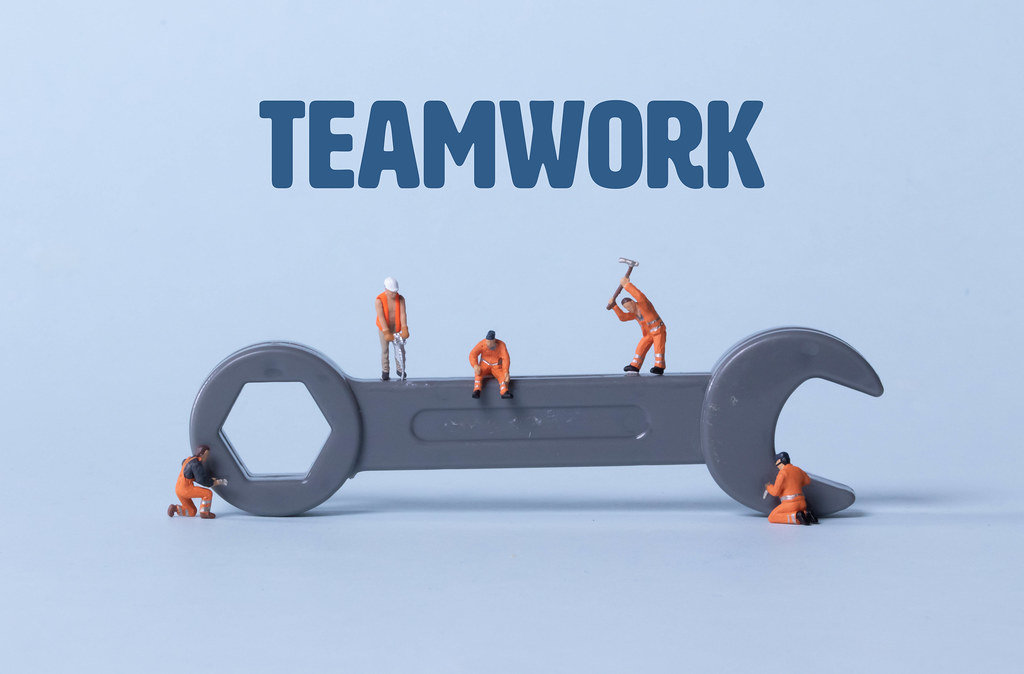 Wrench tool with miniature workers and Teamwork text