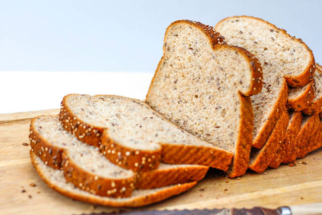 Whole Bread on a Cutting Board