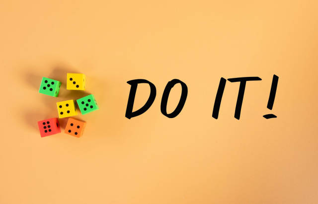Dices with Do it! text on orange background
