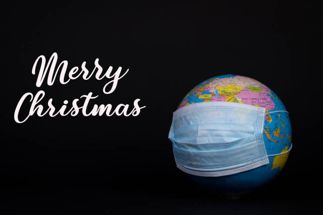 Globe with face mask and Merry Christmas text