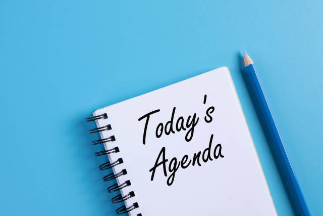 Notebook with 2021 Todays Agenda text on blue background