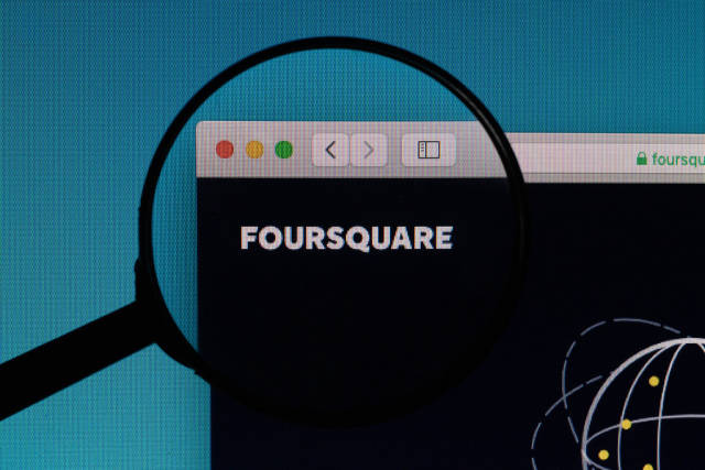 Foursquare logo under magnifying glass