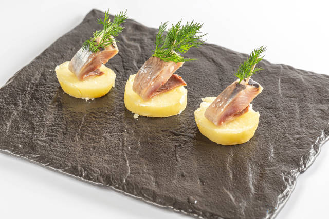 Appetizer of boiled potatoes and herring