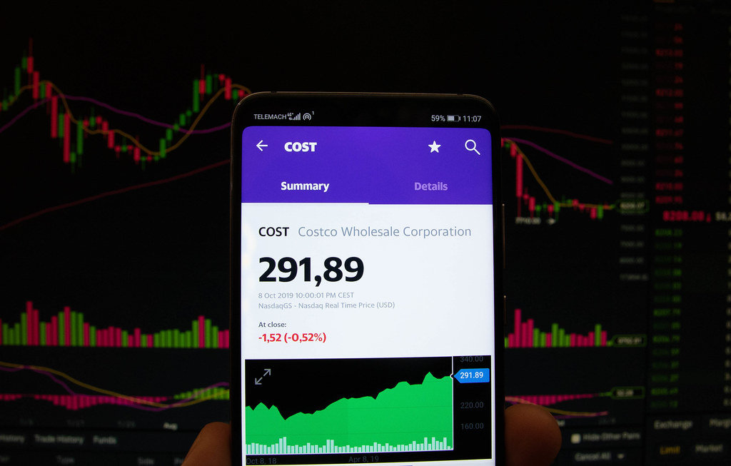 A smartphone displays the Costco Wholesale Corporation market value